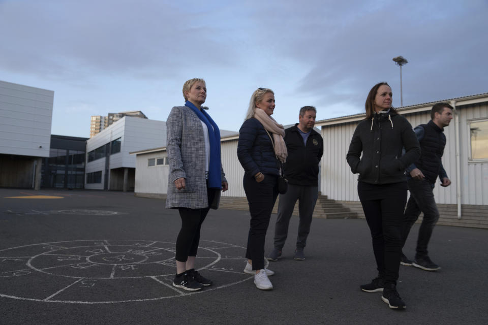 This photo taken Friday 15, June, 2019 shows Linda Hilmarsdottir, Josep Gunnarsson, Marta Sigurjonsdottir, Heidar Atlason, Elsba Danjalsdottir who are part of the "Parent Patrol" in the Korar neighborhood of Reykjavik. Parent patrols to check out the usual youth hangouts form part of the Icelandic strategy to turn around a crisis in teenage drinking and smoking, and it has been so successful that Iceland has one of the lowest rates of youth substance abuse in Europe.(AP Photo/Egill Bjarnason)