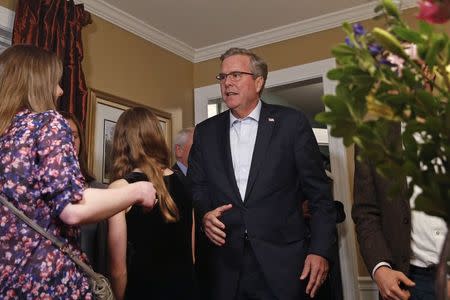 Former Florida Governor Jeb Bush (R) meets guests at a house party during a campaign stop in Dover, New Hampshire March 13, 2015. REUTERS/Shannon Stapleton