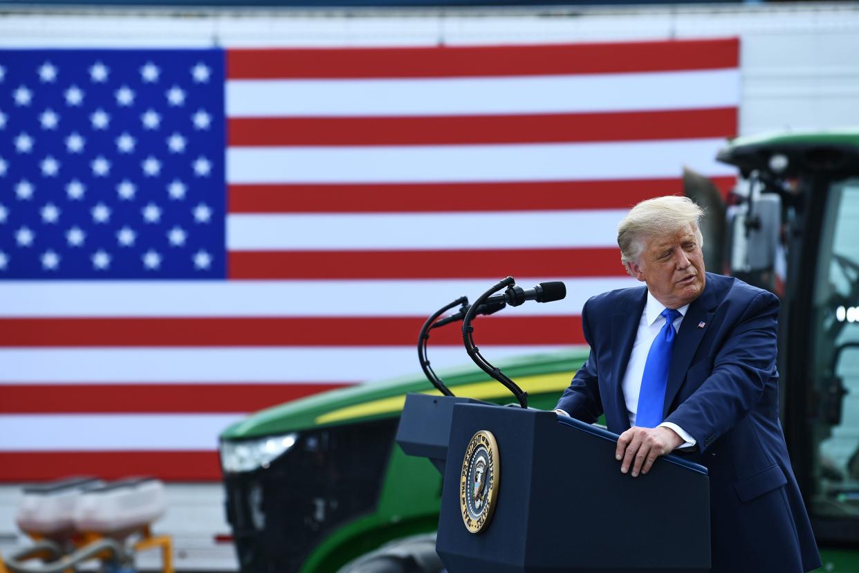 US President Donald Trump gestures as he delivers remarks on Farmers to Families Food Box Program Distribution in Mills River, North Carolina on August 24, 2020. (Photo by Brendan Smialowski / AFP) (Photo by BRENDAN SMIALOWSKI/AFP via Getty Images)