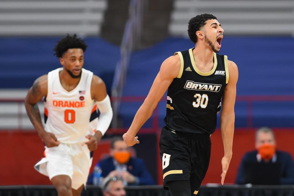 Bryant guard Chris Childs, right, reacts to a play against Syracuse in 2020. The Bulldogs and Orange will play again this year, on Nov. 26 at the Carrier Dome.