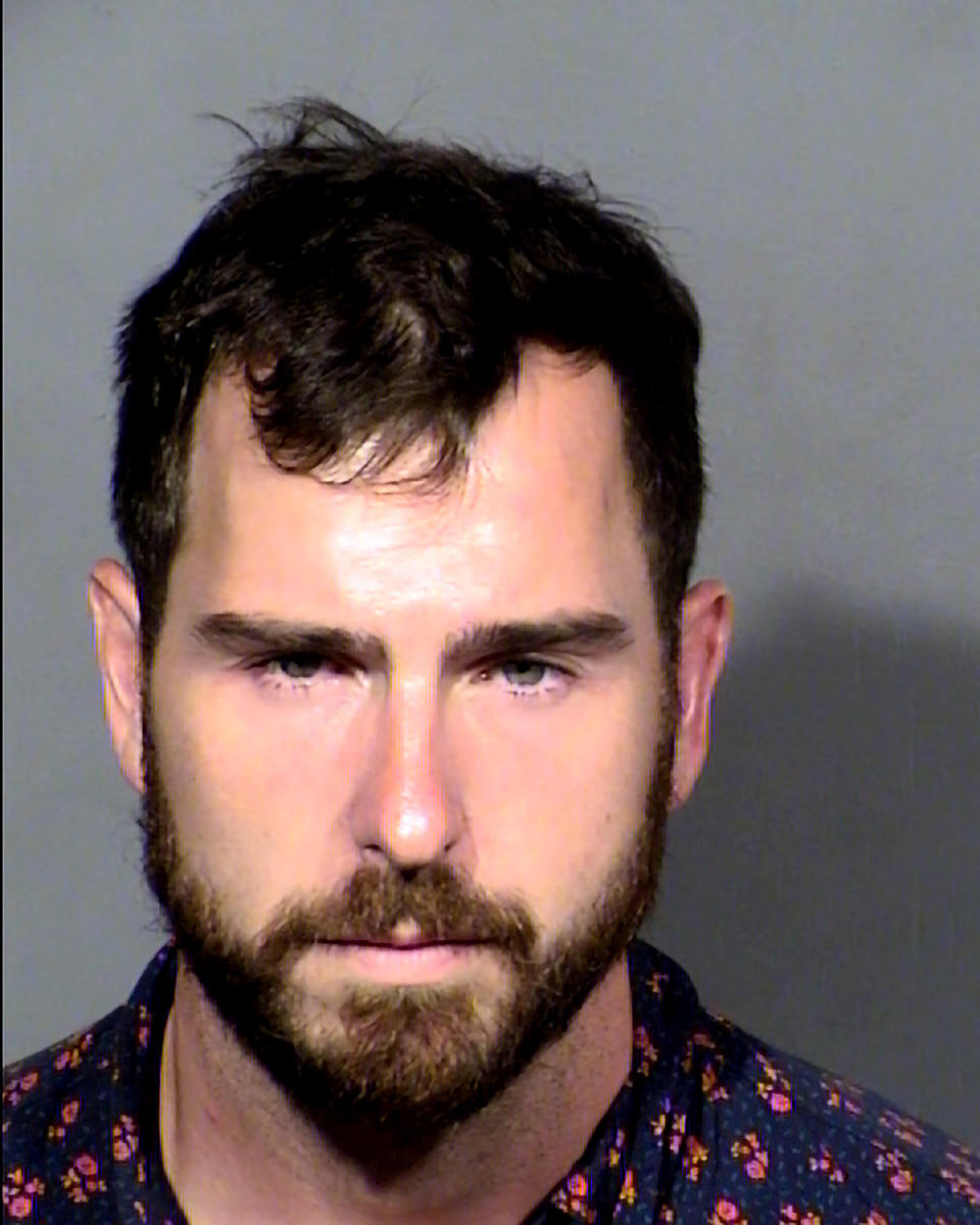 This undated Clark County Detention Center photo shows Stefan Mathias Hutchison, 33, of Oakland, Calif., following his arrest on charges that he breached security on Sunday, Aug. 14, 2022, at Harry Reid International Airport, sparking panic among travelers, flight delays and cancellations. Las Vegas police say Hutchison also was arrested Saturday at the airport after passing TSA screening gates. (Clark County Detention Center/Las Vegas Metropolitan Police Department via AP)