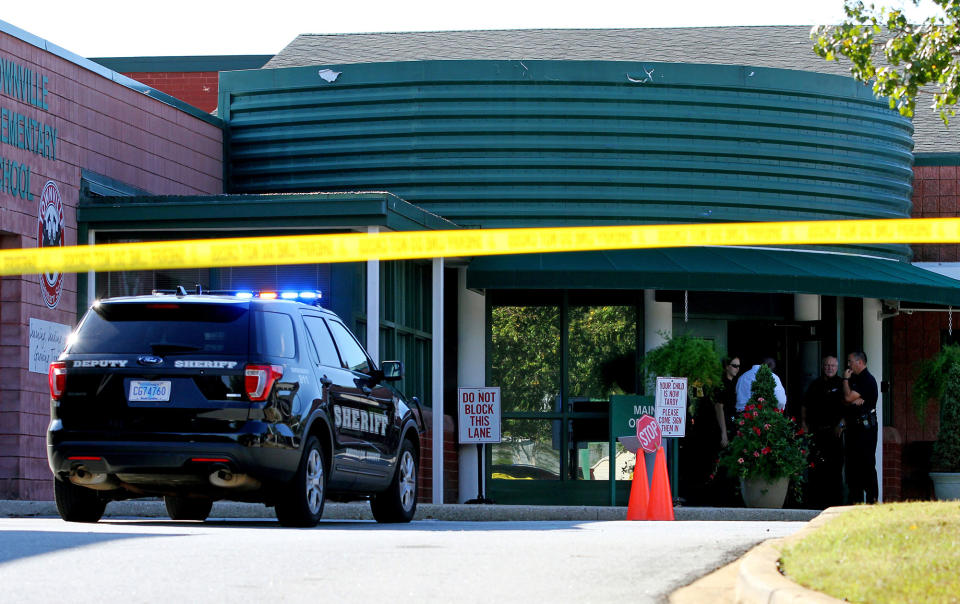 <p>Anderson County sheriff’s deputies and investigators gather outside of Townville Elementary School after a shooting in Townville, S.C., on Sept. 28, 2016. (Nathan Gray/Reuters) </p>