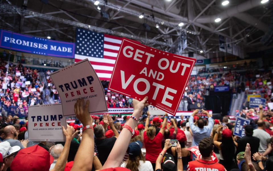 President Donald Trump campaigning in the lead-up to next week's mid-term elections. - AFP