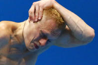 Russia's Ilya Zakharov performs a dive during the men's 3m springboard final at the London 2012 Olympic Games at the Aquatics Centre August 7, 2012. REUTERS/Michael Dalder (BRITAIN - Tags: SPORT DIVING OLYMPICS) 