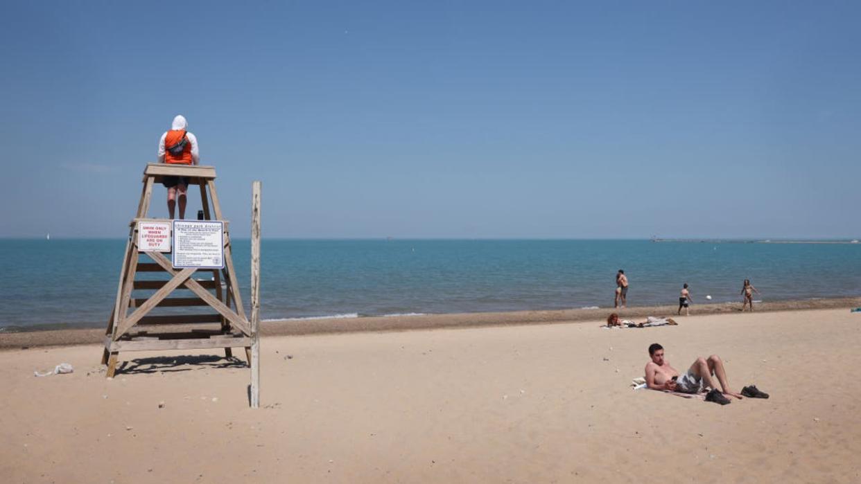 <div>CHICAGO, ILLINOIS - JUNE 03: A lifeguard keeps watch over beachgoers at Oak Street Beach on June 03, 2021 in Chicago, Illinois. (Photo by Scott Olson/Getty Images)</div>
