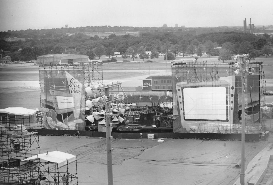 Workers set up a giant stage resembling a drive-in theater for the 1983 concert by Simon & Garfunkel at the Rubber Bowl in Akron.