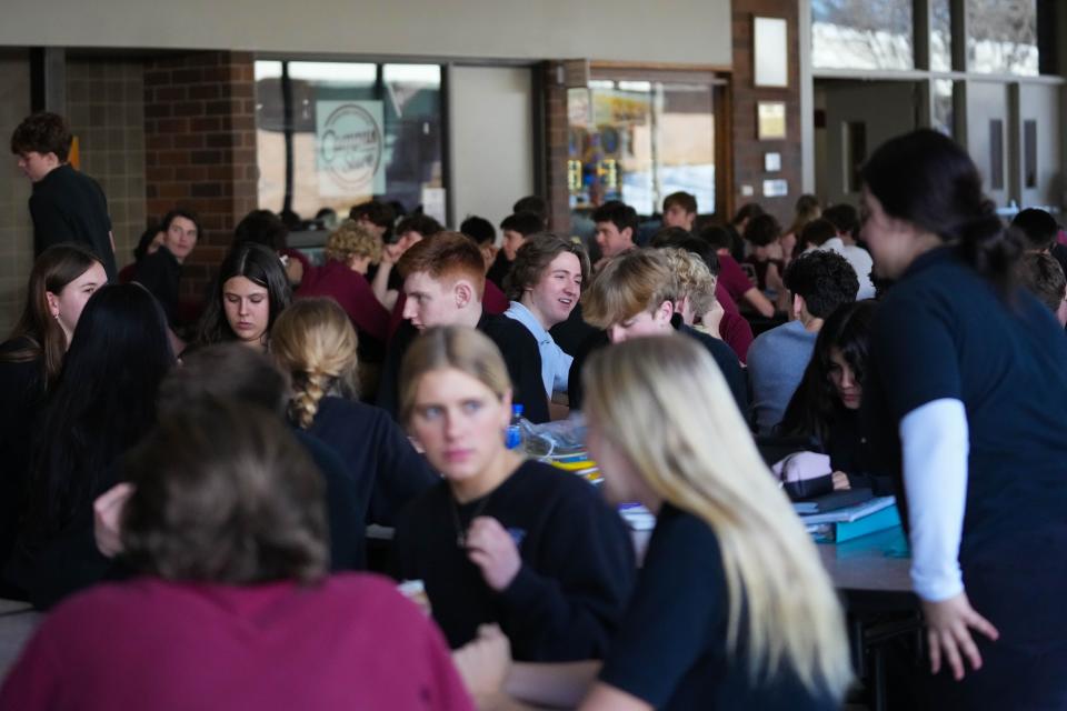 Dowling Catholic students eat lunch in the cafeteria on Thursday, Jan. 26, 2023.