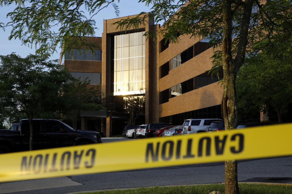 FILE - In this June 29, 2018, file photo, crime scene tape surrounds a building housing The Capital Gazette newspaper's offices, in Annapolis, Md. A pool of 300 potential jurors will be in a Maryland court on Friday, Sept. 27, 2019, to answer questions about the mass shooting at the Capital Gazette newspaper that killed five people last year. Judge Laura Ripken has scheduled three days of jury selection beginning Oct. 30. (AP Photo/Patrick Semansky, File)