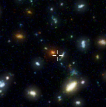 The region of the Hubble Deep Field where HDF850.1 is located. The cross indicates the submillimeter galaxy's position. For observations with ordinary, visible light telescopes such as the Hubble Space Telescope, the galaxy is completely invisi