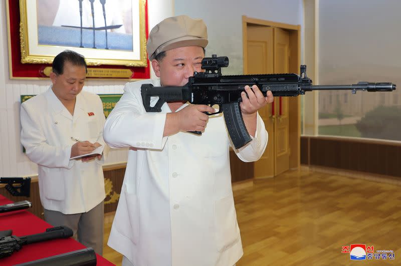 North Korean leader Kim Jong Un gives field guidance at a major weapon factory