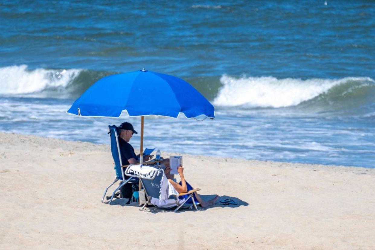 President Biden and wife sitting on the beach