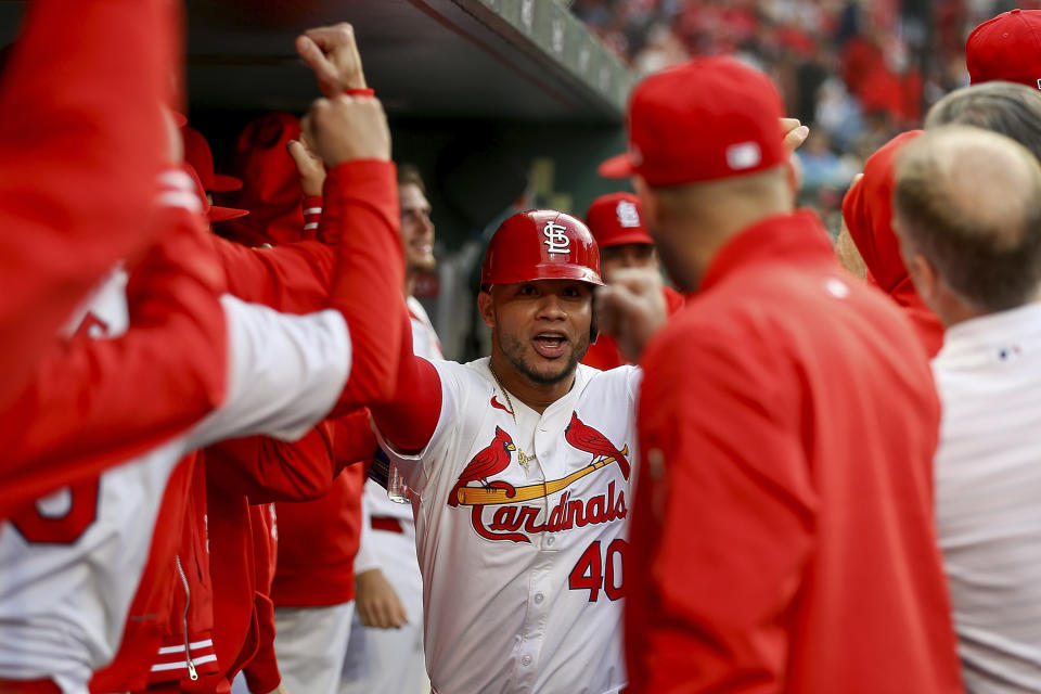 St. Louis Cardinals' Willson Contreras (40) is congratulated by teammates for his solo home run against the Arizona Diamondbacks during the first inning of a baseball game Tuesday, April 23, 2024, in St. Louis. (AP Photo/Scott Kane)