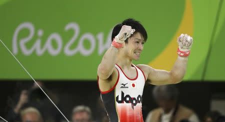 2016 Rio Olympics - Artistic Gymnastics - Final - Men's Individual All-Around Final - Rio Olympic Arena - Rio de Janeiro, Brazil - 10/08/2016. Kohei Uchimura (JPN) of Japan celebrates after his horizontal bar routine during the men's individual all-around final. REUTERS/Mike Blake