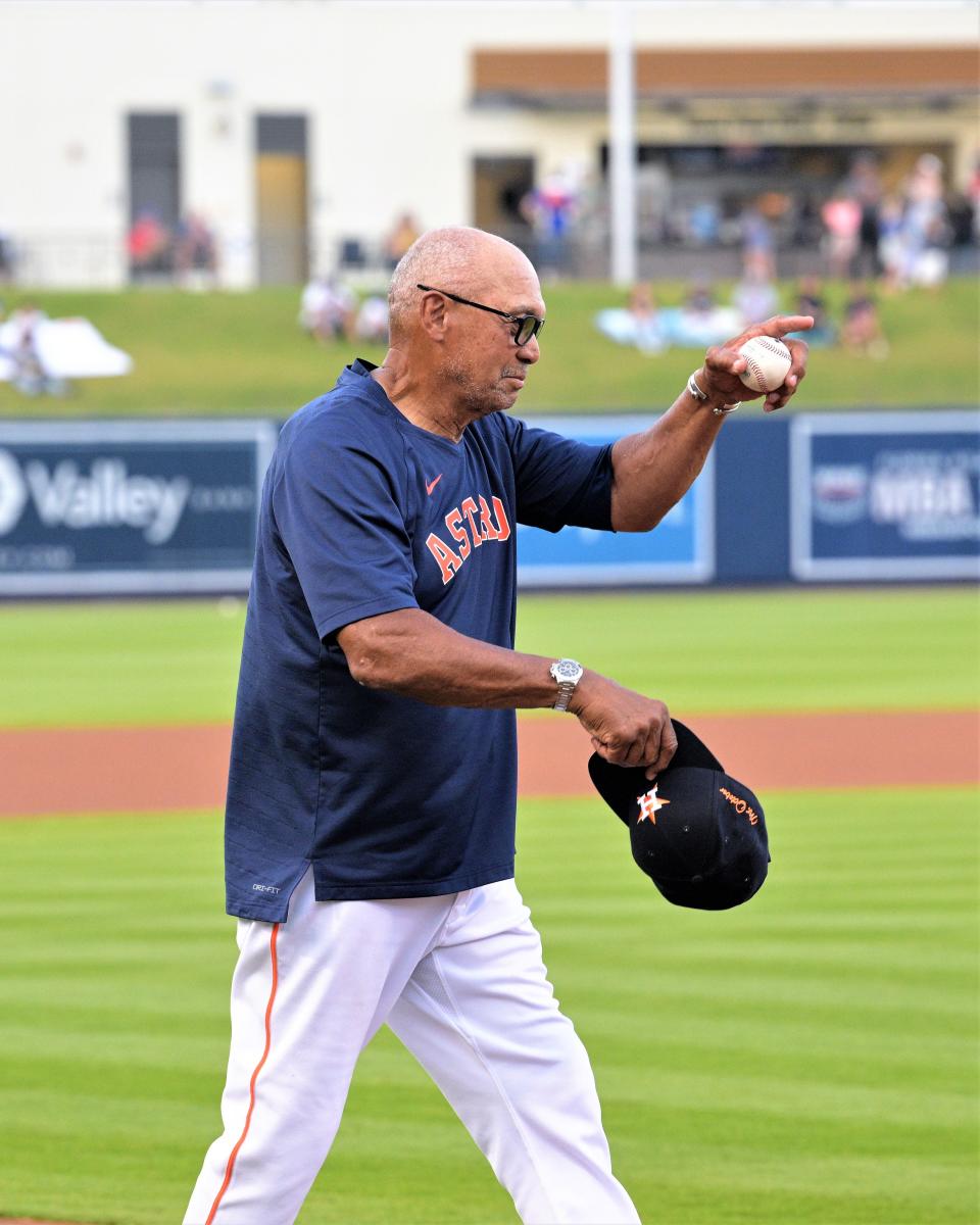 Reggie Jackson walks onto the field in front of a cheering stadium at Ballpark of the Palm Beaches, setting up to throw the game's ceremonial first pitch in celebration of his documentary's upcoming debut on Amazon Prime (Mar. 18, 2023).