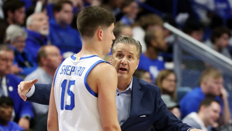 Kentucky head coach John Calipari, right, instructs Reed Sheppard (15) during a game against Mississippi, Tuesday, Feb. 13, 2024, in Lexington, Ky.