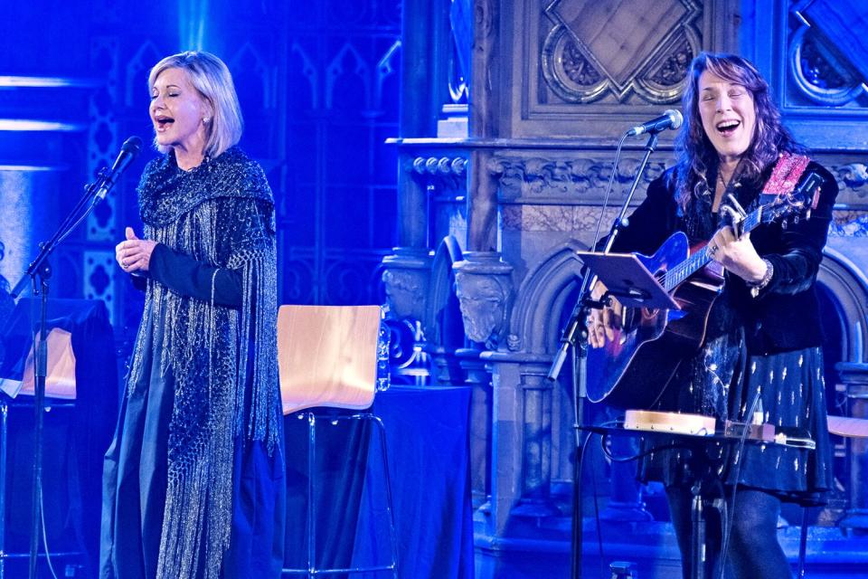 LONDON, ENGLAND - JANUARY 26: Ruth Trimble (L), Olivia Newton-John and Beth Nielsen Chapman perform at the Union Chapel on January 26, 2017 in London, England. (Photo by Imelda Michalczyk/Redferns)