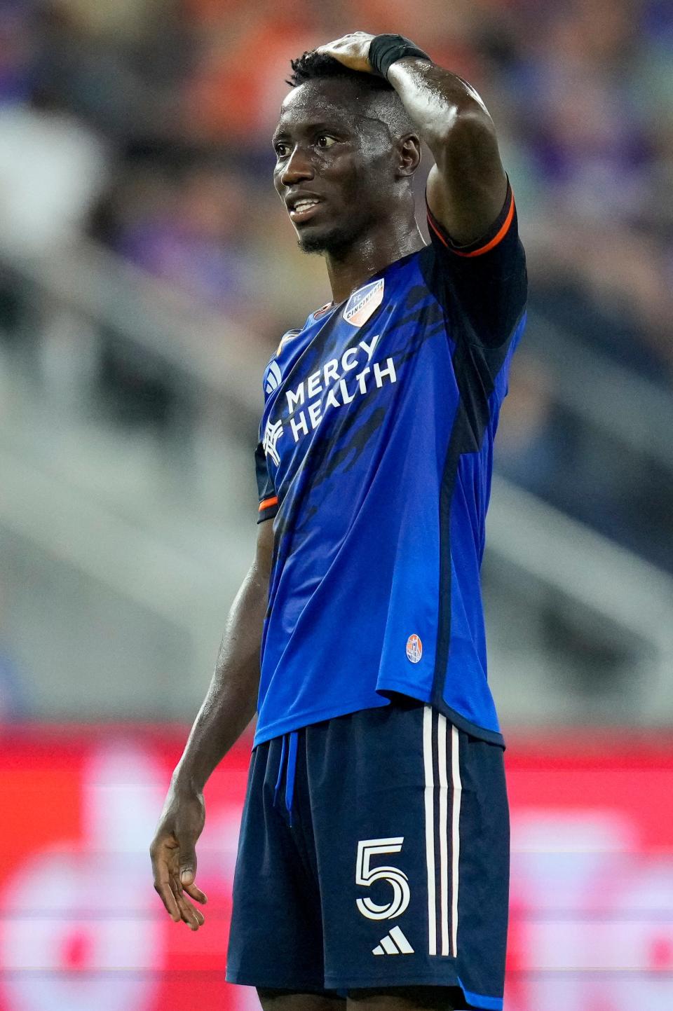 FC Cincinnati midfielder Obinna Nwobodo (5) rubs his head as time runs down in the second half of the MLS match between FC Cincinnati and Orlando City at TQL Stadium in the West End neighborhood of Cincinnati on Saturday, Sept. 2, 2023. Orlando City won the match 1-0.