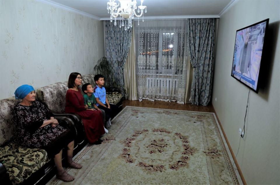 A Kazakh family watch a documentary on China-Kazakhstan economic cooperation at their home in Astana, then called Nur-Sultan, Kazakhstan, on Oct. 9, 2020.<span class="copyright">Kalizhan Ospanov/Xinhua via Getty</span>