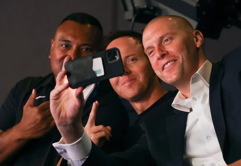 BYU football coach Kalani Sitake, Utah Jazz owner Ryan Smith, and BYU basketball coach Mark Pope take a selfie.