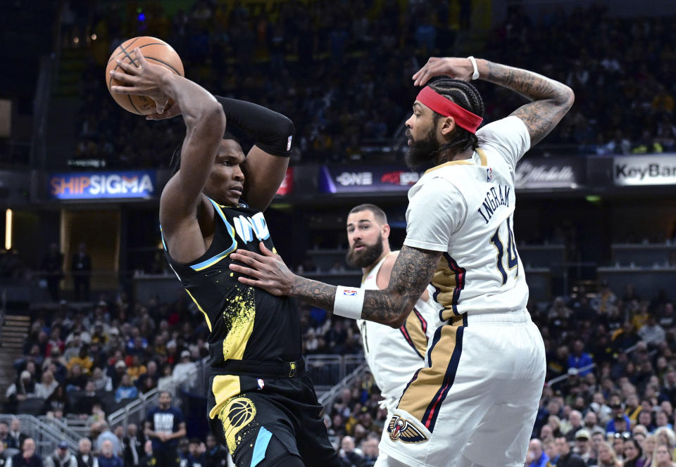 Indiana Pacers guard Bennedict Mathurin is defended by New Orleans Pelicans forward Brandon Ingram during the first half of an NBA basketball game Wednesday, Feb. 28, 2024, in Indianapolis. (AP Photo/Marc Lebryk)