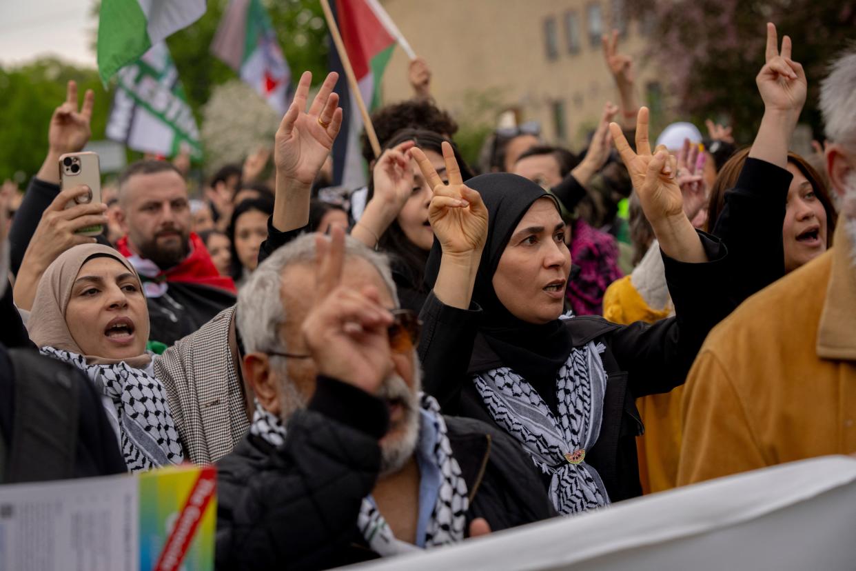 Demonstrators carry Palestinian flags and make the victory sign as they protest against Israel's participation in Eurovision in Malmö, Sweden, on May 9, 2024.