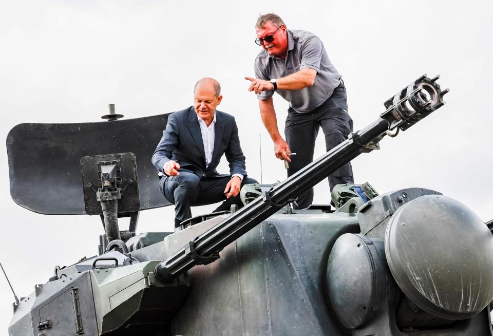 German chancellor Olaf Scholz inspects an anti-aircraft gun. (REUTERS)
