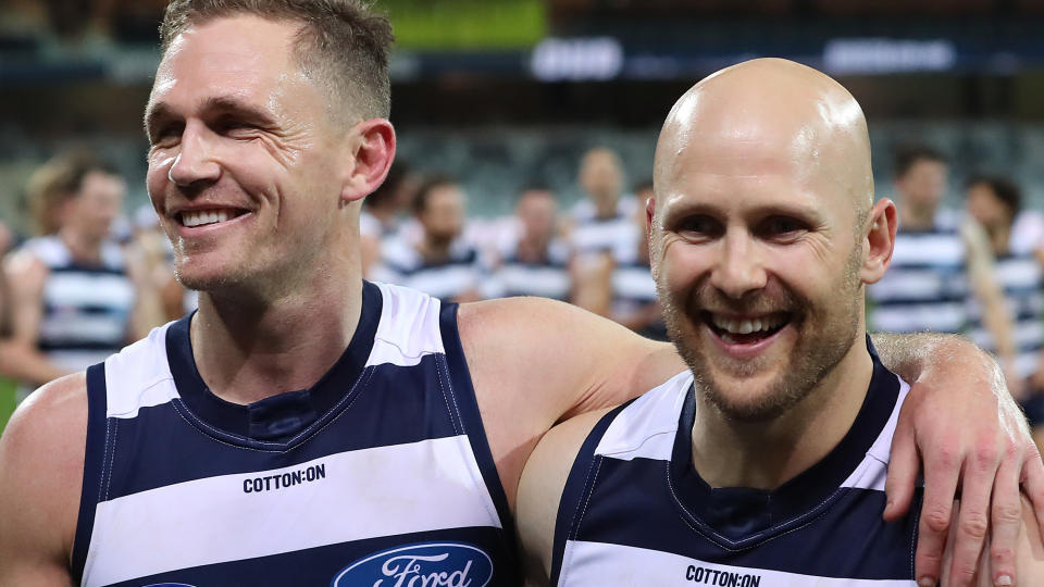 Gary Ablett and Joel Selwood of the Cats leave the field following victory in the round 5 match against the Gold Coast Suns. (Photo by Graham Denholm/AFL Photos via Getty Images )