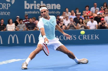 Roger Federer of Switzerland returns the ball to Dominic Thiem of Austria during their semi-final match at the Brisbane International Tennis Tournament in Brisbane, January 9, 2016. REUTERS/Dave Hunt/AAP