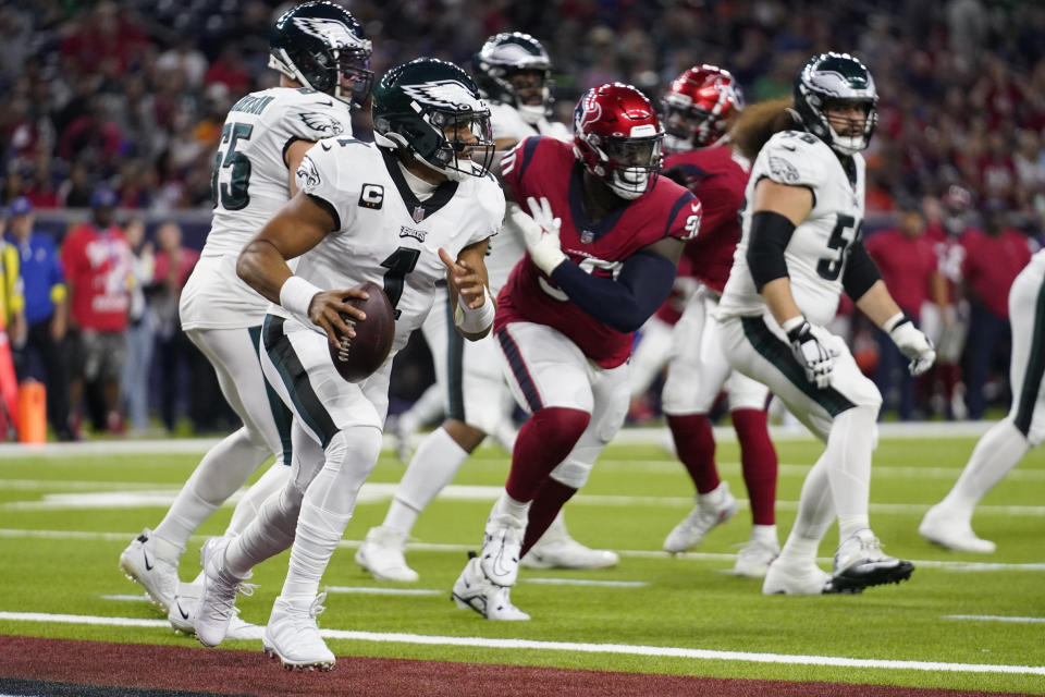 Philadelphia Eagles quarterback Jalen Hurts (1) scrambles in the end zone in the second half of an NFL football game against the Houston Texans in Houston, Thursday, Nov. 3, 2022. (AP Photo/Tony Gutierrez)