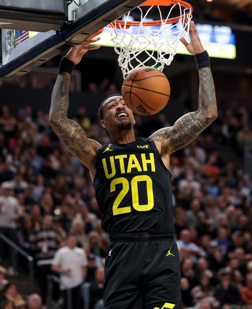 Utah Jazz forward <a class="link " href="https://sports.yahoo.com/nba/players/5832" data-i13n="sec:content-canvas;subsec:anchor_text;elm:context_link" data-ylk="slk:John Collins;sec:content-canvas;subsec:anchor_text;elm:context_link;itc:0">John Collins</a> (20) dunks during the game at the Delta Center in Salt Lake City on Wednesday, Nov. 1, 2023. | Spenser Heaps, Deseret News