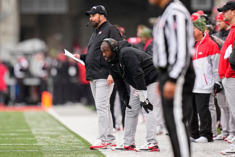 Nov 12, 2022; Columbus, Ohio, USA;  Ohio State Buckeyes head coach Ryan Day and running backs coach Tony Alford watch from the sideline during the second half of the NCAA football game against the Indiana Hoosier at Ohio Stadium. Ohio State won 56-14. Mandatory Credit: Adam Cairns-The Columbus Dispatch