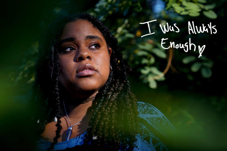 NaJaRee Nixon, 32, of Southfield, in the forested area outside of her apartment complex in Southfield on Wednesday, Aug. 16, 2023. Nixon said being outside is her "safe space" and that she spent a lot of time in nature during her healing journey. "The more I'm around trees and everything thats outside of what we constantly have to deal with all day, is like a mini vacation and a cleansing," Nixon said. Being outside, "feels like breathing," Nixon said. "It feels natural to me."