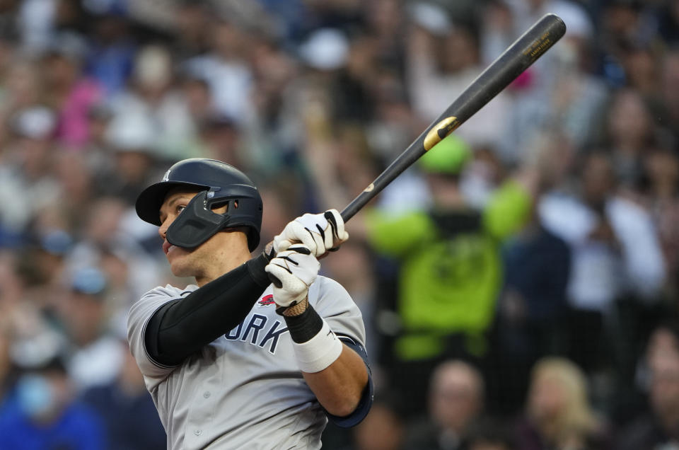 New York Yankees' Aaron Judge follows through on a solo home run against the Seattle Mariners during the sixth inning of a baseball game Monday, May 29, 2023, in Seattle. (AP Photo/Lindsey Wasson)