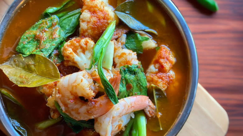 bowl of soup with basil shrimp