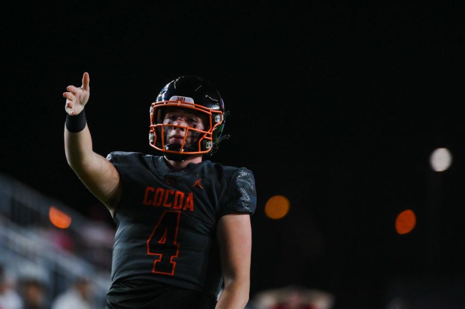 Cocoa quarterback Davin Wydner (4) celebrates a quarterback keeper that gained a first down during the Class 4A State Championship game between Cardinal Gibbons and Cocoa Beach at DRV PNK Stadium in Fort Lauderdale, FL., on Thursday, December 16, 2021.