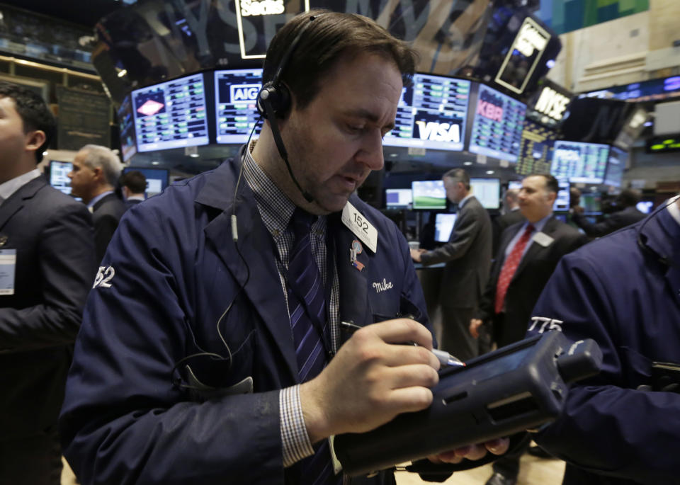 Trader Michael Mozian works on the floor of the New York Stock Exchange Tuesday, March 25, 2014. Stocks are opening higher on Wall Street as the market shrugs off a two-day decline. (AP Photo/Richard Drew)