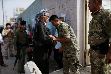 Kurdish security men inspect people during Kurds independence referendum in Erbil, Iraq September 25, 2017. REUTERS/Ahmed Jadallah