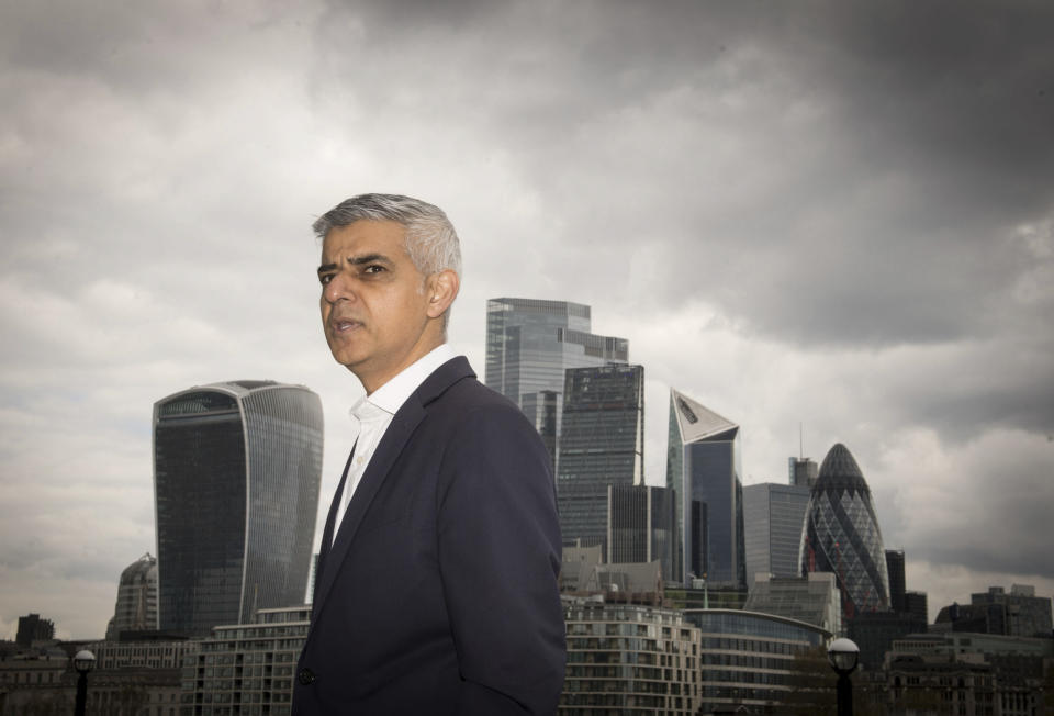 The Mayor of London, Sadiq Khan stands near City Hall on the South Bank of the Thames in London on Thursday April 29, 2021. On May 6, Londoners will elect a mayor, whose performance will help determine whether this is the start of a period of decline for Europe's biggest city — or a chance to do things better. Current Mayor Sadiq Khan, who is favored to win re-election, says his top priority is preserving jobs threatened by the economic blow of the pandemic. Rival Shaun Bailey says his top priority is crime. (Stefan Rousseau/PA via AP)