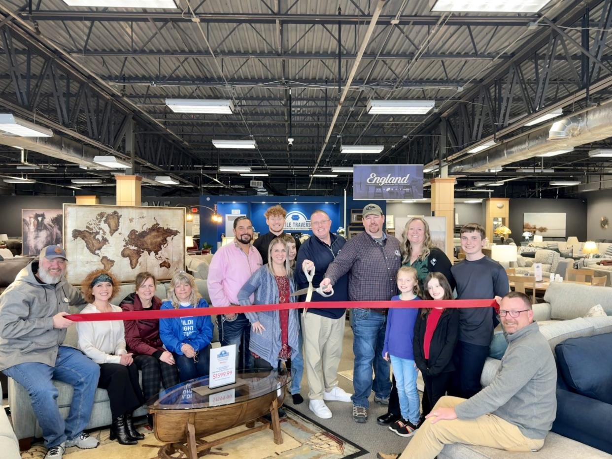 The grand opening for Little Traverse Furniture and Mattresses was held in Petoskey recently. Pictured in the back row (from left): Jeremiah Pheasant, Jaden Emerson, Steven Emerson (owner), Brandon Steffel (owner), Jessica Steffel (owner) and Timothy Steffel. Front row (standing from left): Monique Emerson (owner), Brady Emerson, Willow Steffel and Serenity Steffel. Chamber of Commerce Ambassadors (seated from left): Aaron Garms (Keep it Real Social), Nikki Devitt (Petoskey Chamber of Commerce), Andrea Koch (Women's Resource Center), Sue Leestma (PNC Bank) and Ron Olson (Mitchell Graphics).