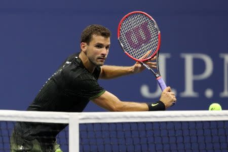 Sep 5, 2016; New York, NY, USA; Grigor Dmitrov of Bulgaria hits a volley against Andy Murray of Great Britain (not pictured) on day eight of the 2016 U.S. Open tennis tournament at USTA Billie Jean King National Tennis Center. Mandatory Credit: Geoff Burke-USA TODAY Sports