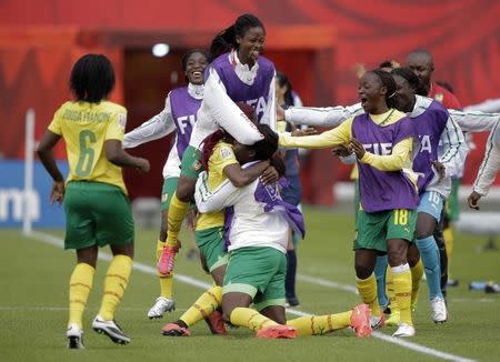 Cameroon forward Madeleine Ngono Mani (9) celebrates with teammates after scoring a goal during the second half against Switzerland in a Group C soccer match in the 2015 FIFA women's World Cup at Commonwealth Stadium. Mandatory Credit: Erich Schlegel-USA TODAY Sports