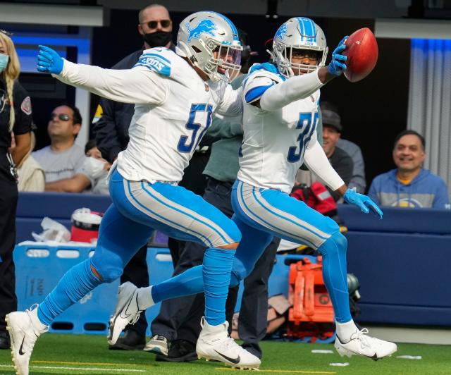 Detroit Lions running back D'Andre Swift celebrates his touchdown run