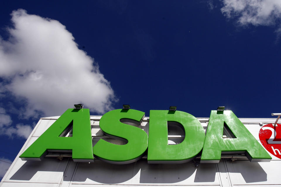 FILE - In this file photo dated Tuesday July 17, 2007, the sign of an Asda store in Wallington, England.  It is reported Monday April 30, 2018, Sainsbury's has agreed a merger deal with Walmart Inc.'s U.K. unit, Asda, for 7.3 billion pounds (dollars 10.1 billion U.S.) in cash and stock in a deal that would create Britain's largest supermarket chain, but the deal will be subject to review by Britain's Competition and Markets Authority. (AP Photo/Tom Hevezi, FILE)