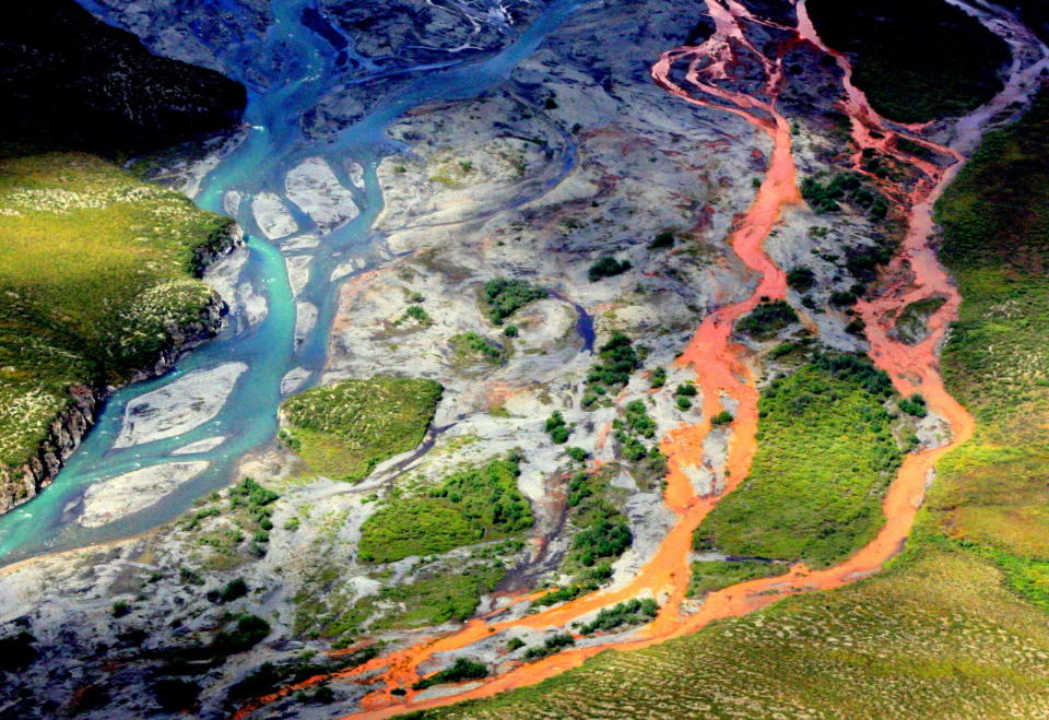 An aerial view of the rust-colored Kutuk River in Gates of the Arctic National Park in Alaska. (<a href="https://www.ucdavis.edu/climate/news/alaskas-rusting-waters-pristine-rivers-and-streams-turning-orange" rel="nofollow noopener" target="_blank" data-ylk="slk:Ken Hill/National Park Service;elm:context_link;itc:0;sec:content-canvas" class="link ">Ken Hill/National Park Service</a>)