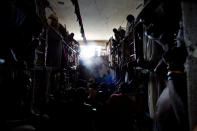 <p>Prisoners cram shoulder to shoulder to watch TV in their crowded cell inside the National Penitentiary in downtown Port-au-Prince, Haiti, Feb. 13, 2017. Sentenced convicts and the far greater numbers of suspects still awaiting trial, pool together what little money they can scare up to buy small TVs and radios for their shared cells. (Photo: Dieu Nalio Chery/AP) </p>