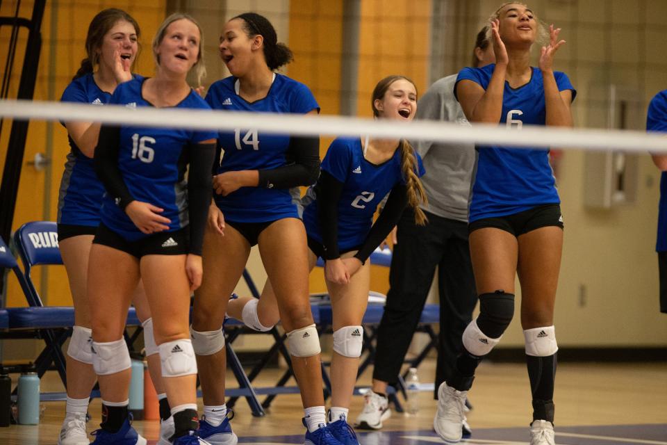 The Washburn Rural bench explodes after a point made against St. Thomas Aquinas during the second set of Thursday's match.