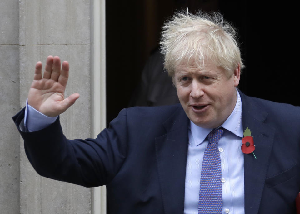 Britain's Prime Minister Boris Johnson leaves 10 Downing Street to attend Parliament in London, Wednesday, Oct. 30, 2019. Britons will be heading out to vote in the dark days of December after the House of Commons on Tuesday backed an early national vote that could break the country's political impasse over Brexit — or turn out to be merely a temporary distraction. (AP Photo/Kirsty Wigglesworth)