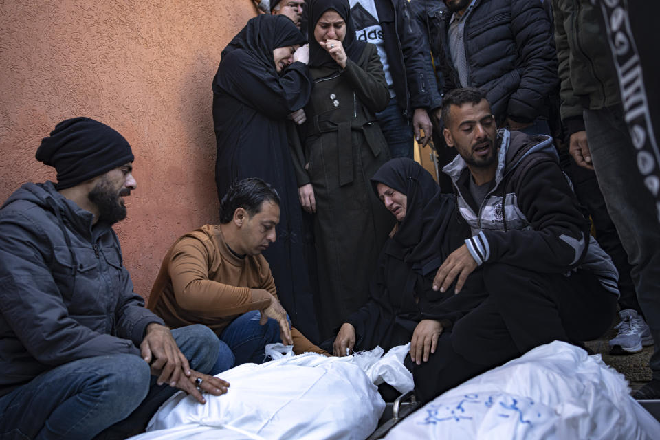 Palestinians mourn their relatives killed in the Israeli bombardment of the Gaza Strip, in the hospital in Khan Younis, Saturday, Dec. 2, 2023. (AP Photo/Fatima Shbair)