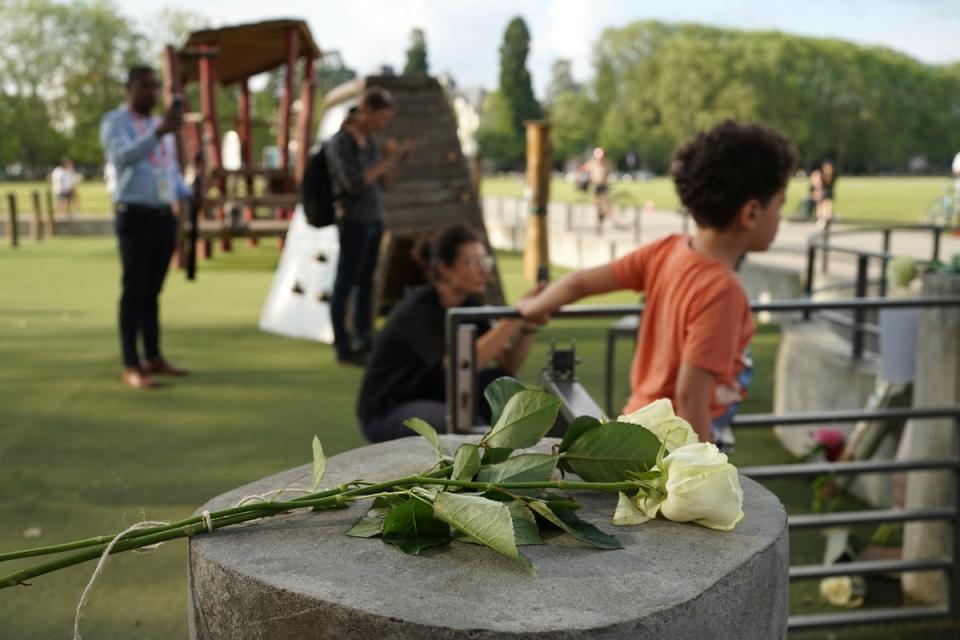 Flowers and teddy bears were laid at the playpark after the attack (AP Photo/Laurent Cipriani)