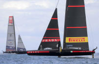 United States' American Magic, left, sails against Italy's Luna Rossa on the third day of racing of the America's Cup challenger series on Auckland's Waitemate Harbour, New Zealand, Sunday, Jan. 17, 2021. (Michael Craig/NZ Herald via AP)